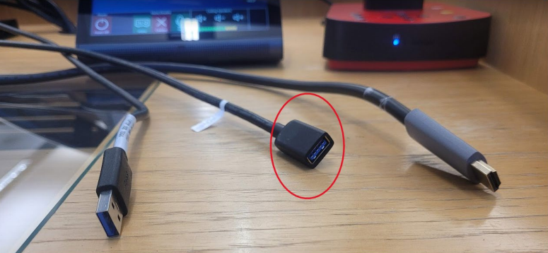 USB extension cable on top of lectern to put thumb drive into